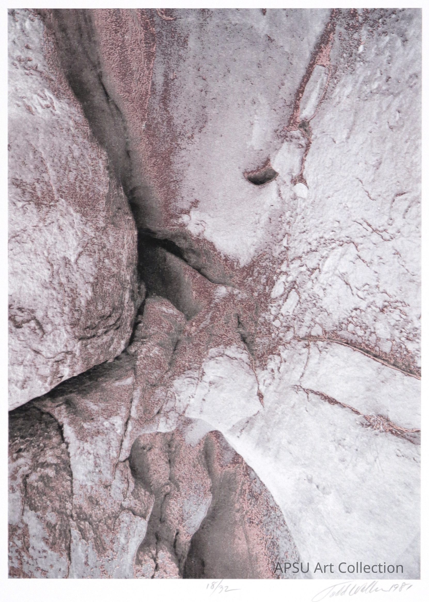 The image depicts a textured surface resembling rocks with varying tones and patches of dark pink and gray, showing what appears to be natural erosion or formations, evoking a raw yet serene aesthetic; the bottom of the image shows the number "18/32" and a signature, indicating it might be a part of a limited series by an artist.