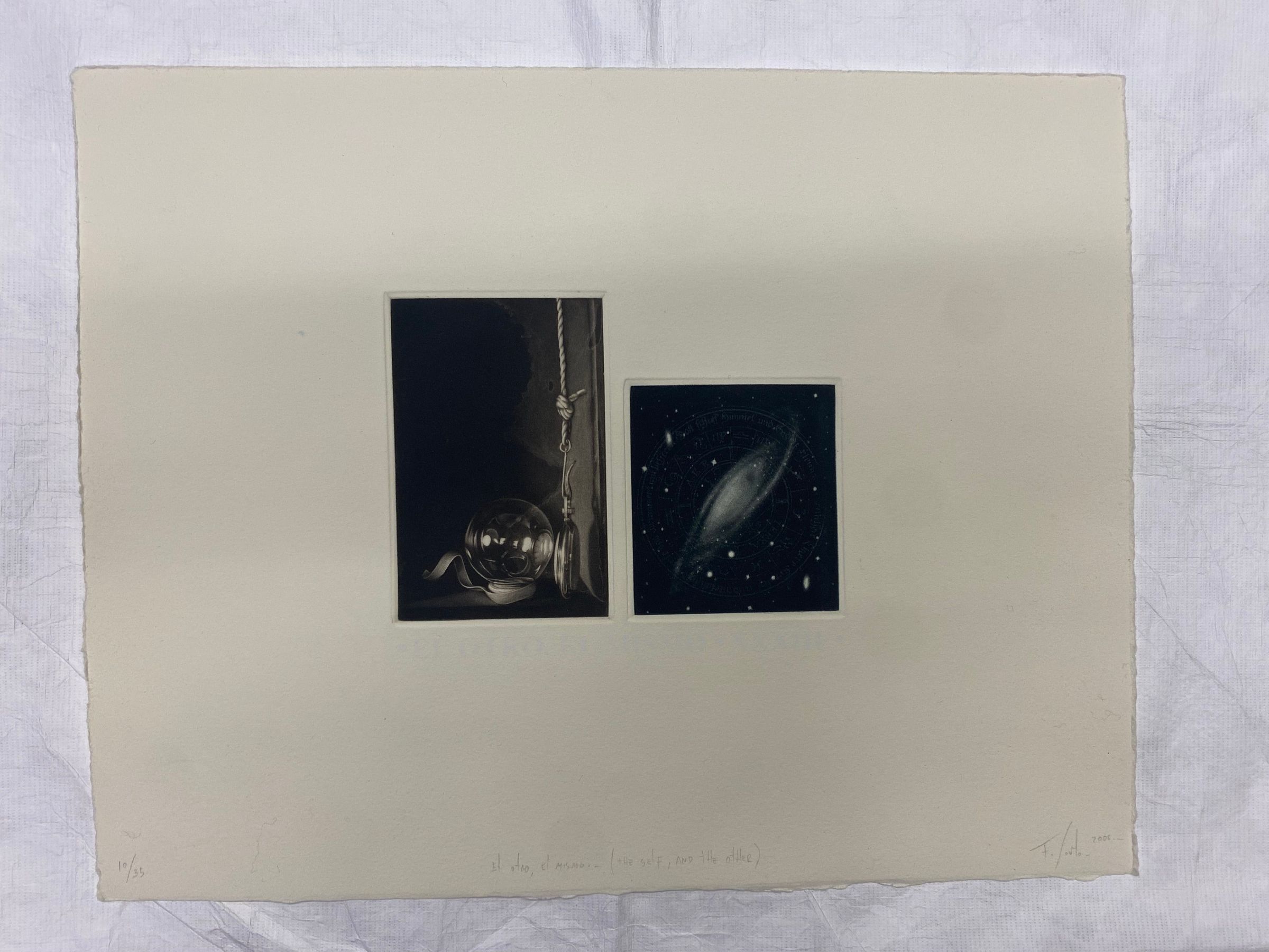 El Otro, El Mismo XXXIII (10/35): Medium sized print horizontally oriented with two vertically oriented centrally placed images on cotton rag paper. The first image on the right proper is of a pocket watch hanging from a hook on a rope reflecting in a glass orb with a small ribbon beneath it against a dark background. The second image on the left proper is of a start nebula against a space background and a lightly printed astrological wheel surrounding it. Directly beneath the images printed in white against the cream paper background.
