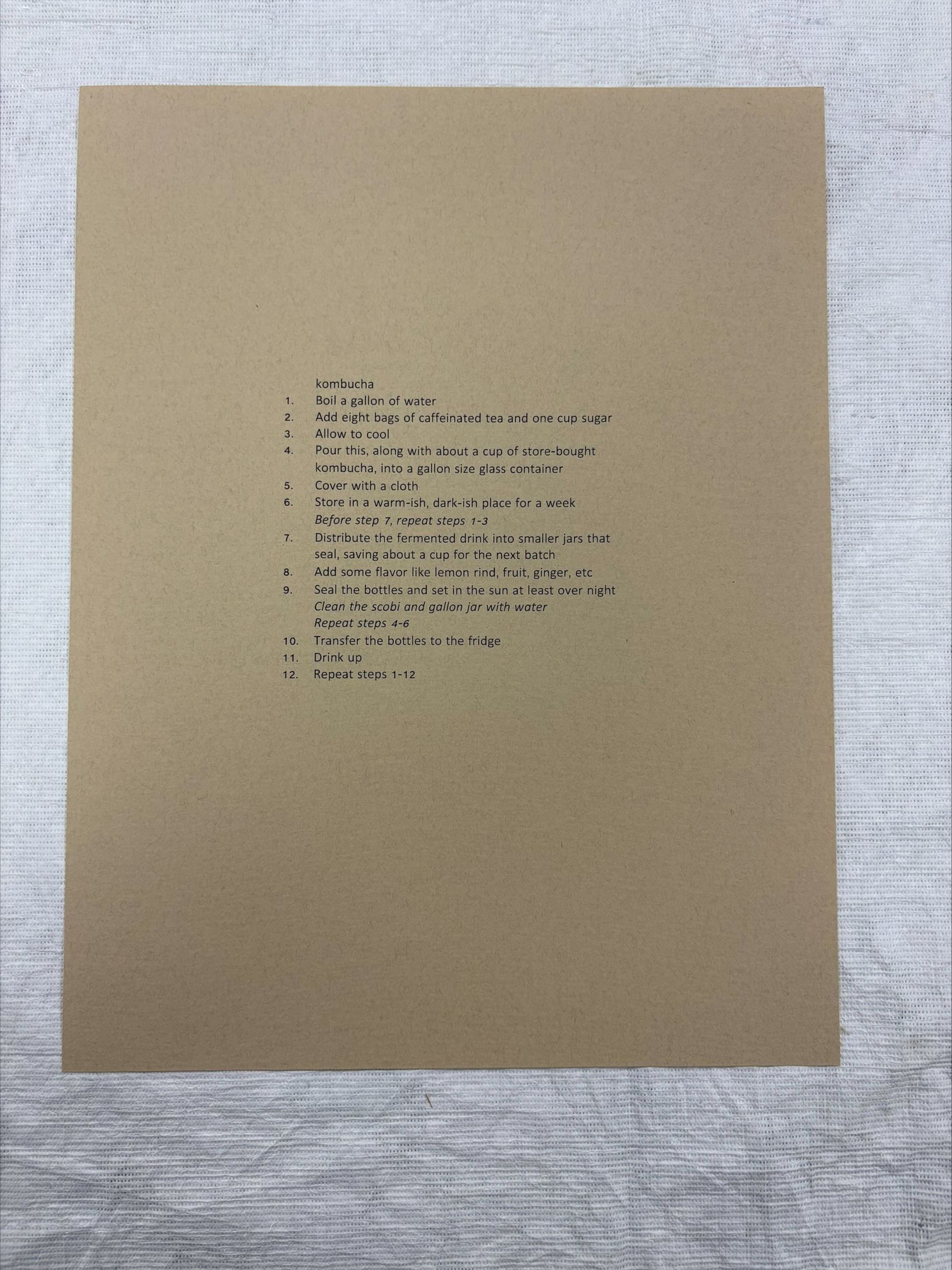 Front: A vertical oriented, medium sized Xerox print done on handmade paper. The print is just a series of text that explain the steps that one needs to take to make kombucha.