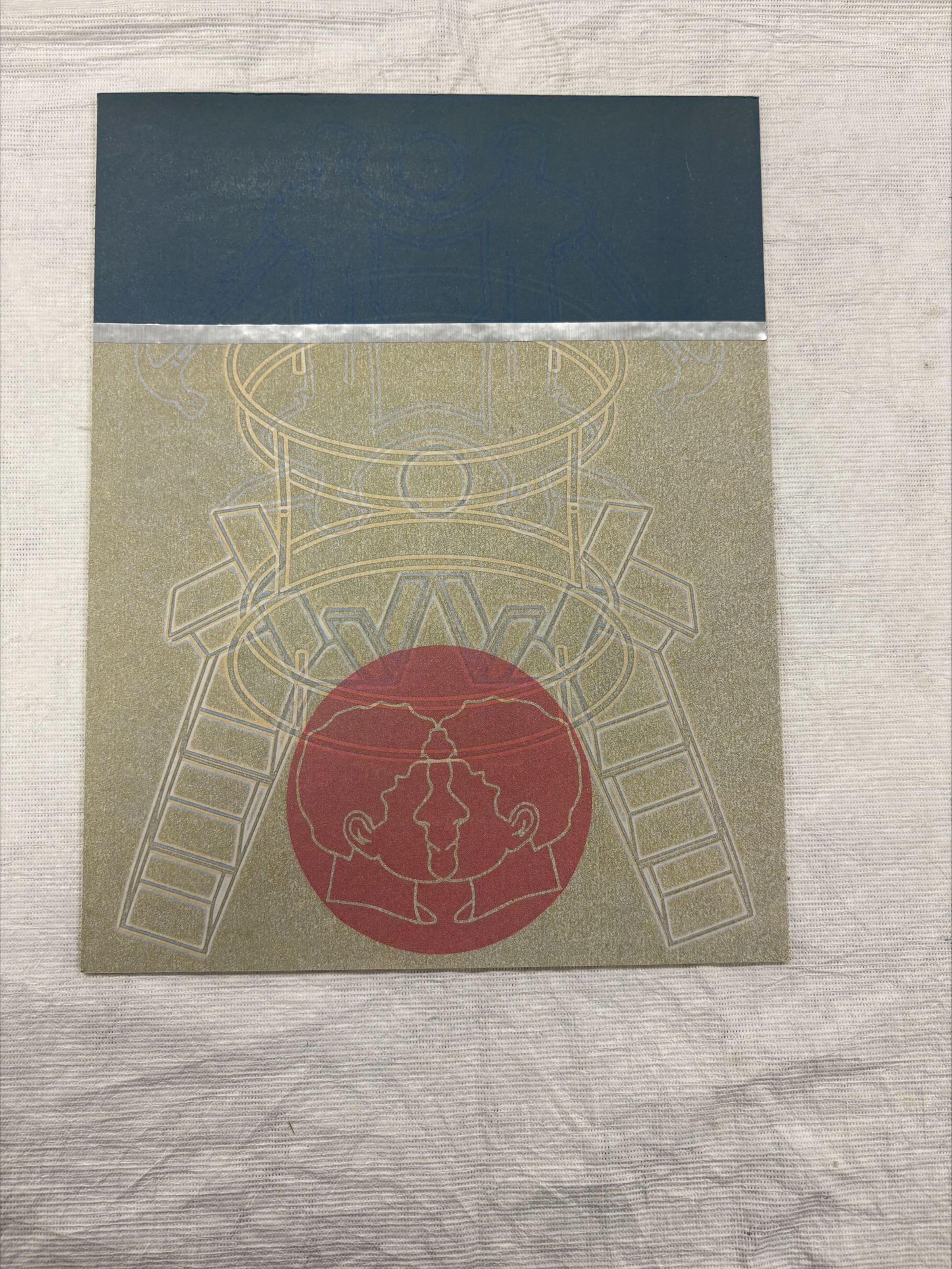 Front: A vertical oriented, standard letter sized multi-technique print done on cork. The print has imagery of geometric shapes and human faces in profile on the front and back.