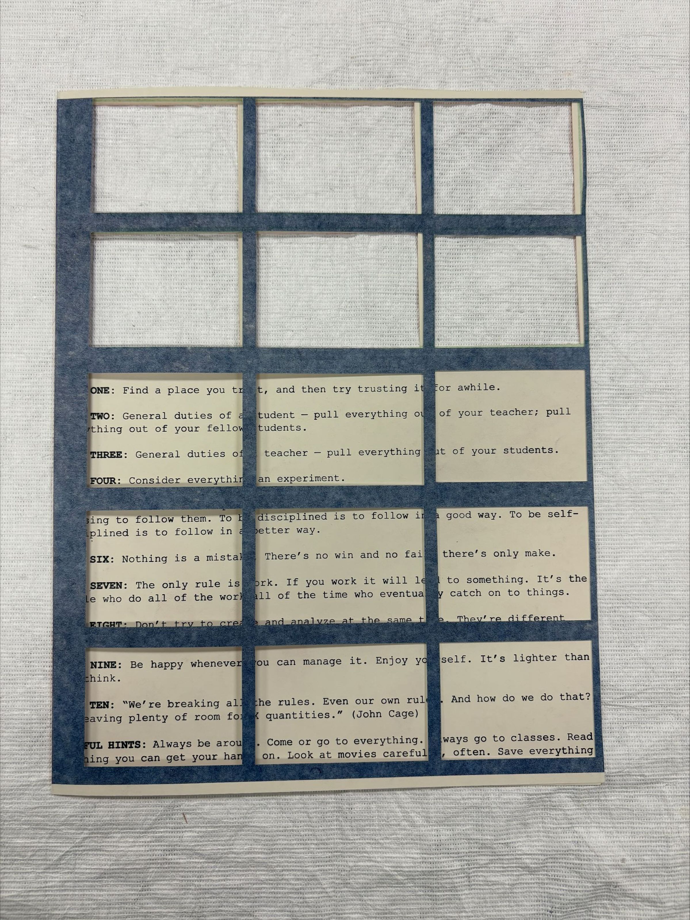 Front: A vertical oriented, medium sized risograph and letterpress print created with die-cut paper. The front of the print has window cut-outs that reveal the main print and text underneath.