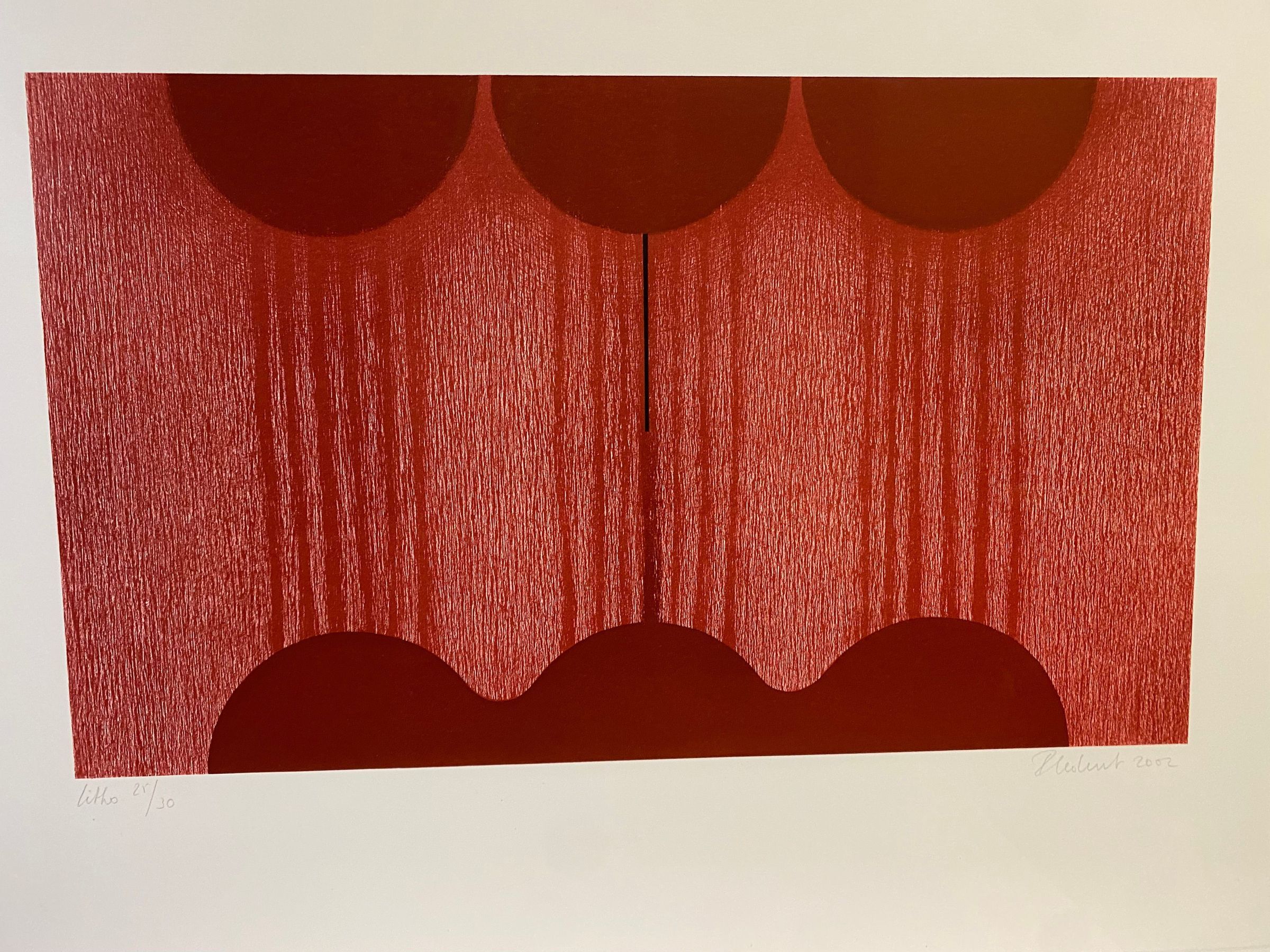Litho (25/30): Large horizontally oriented abstract etching utilizing red and black tones centers on paper with straight cut edges. This abstraction comprises of three half-circular forms across the top of the page with a small black line pointing downward from the top center shape and a wavy geometric form with three curved hoops across the bottom connecting the shapes with heavily pigmented red vertical lines against a background made up of red etching marks.
