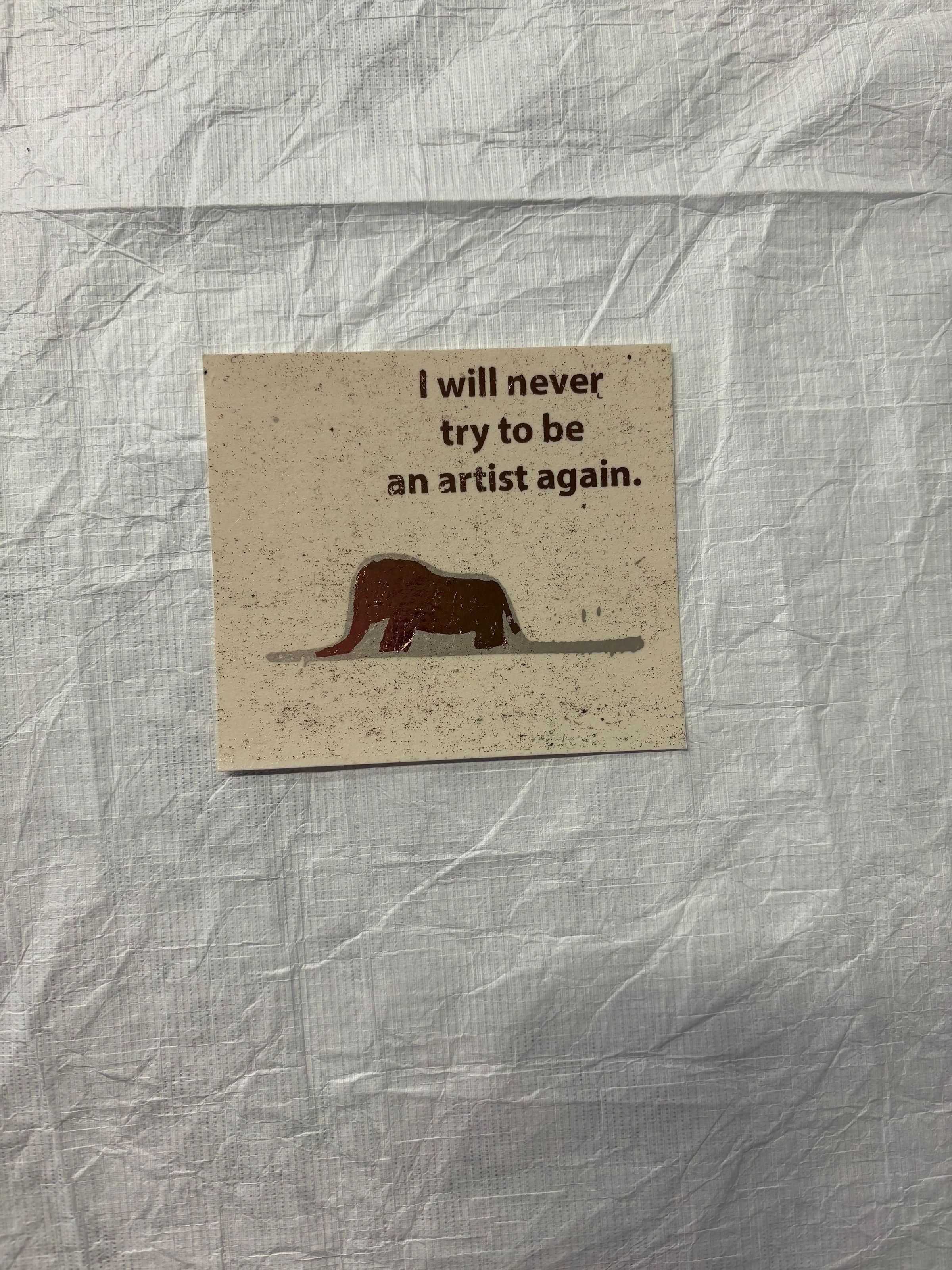 Front: A small, horizontally oriented print that utilizes both text and imagery to construct the print. At the center is the silhouette of an elephant and at the top near the proper left corner is a series of words. This print is done on a cream colored paper and uses primarily grey and bronze colors.