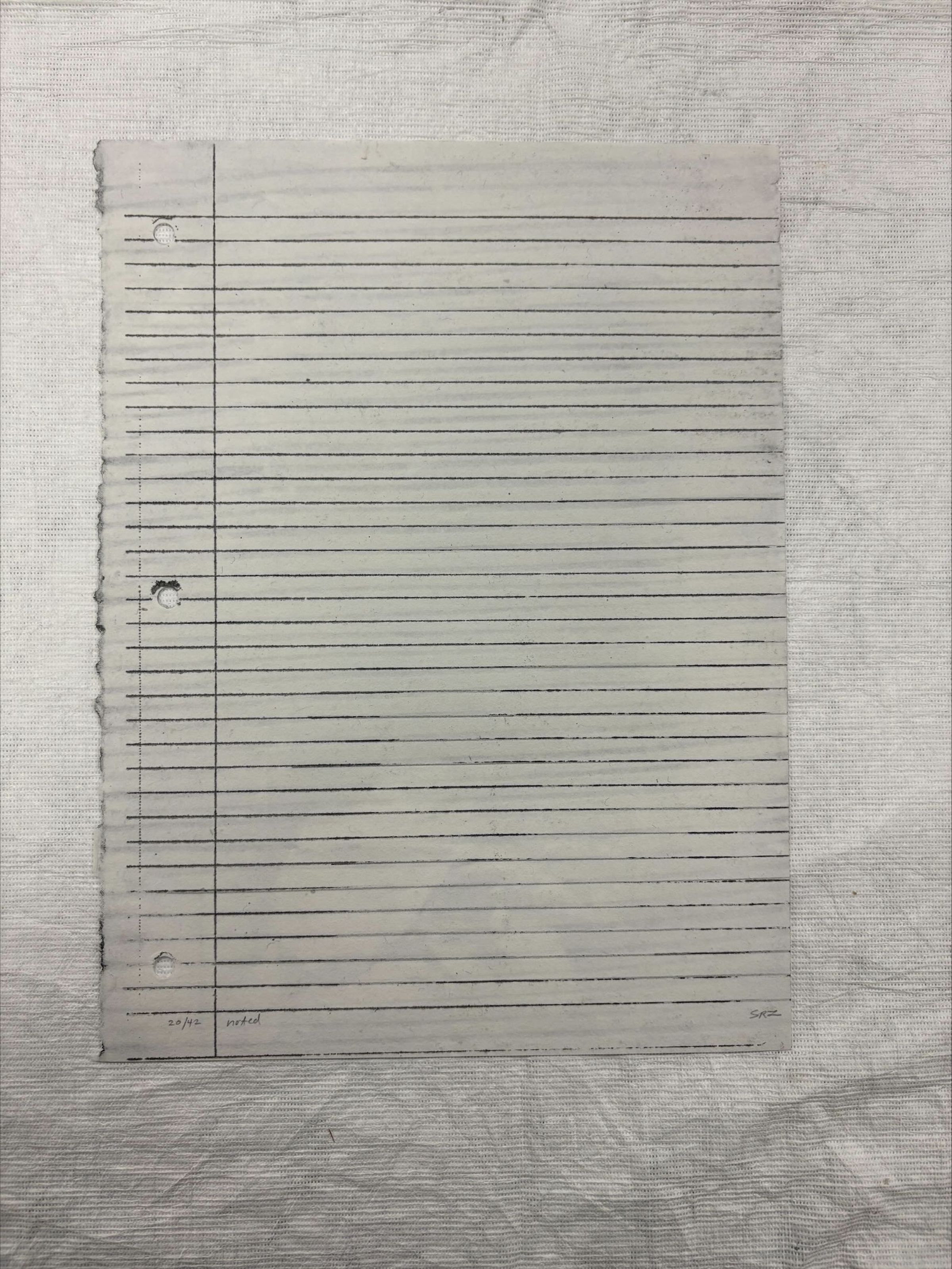 Front: vertically oriented, standard letter sized screen print done on handmade and water marked paper with graphite. The prints depicts a black piece of notebook paper that is clean and unmarked on the front, while on the back the paper is crumpled and shaded on.