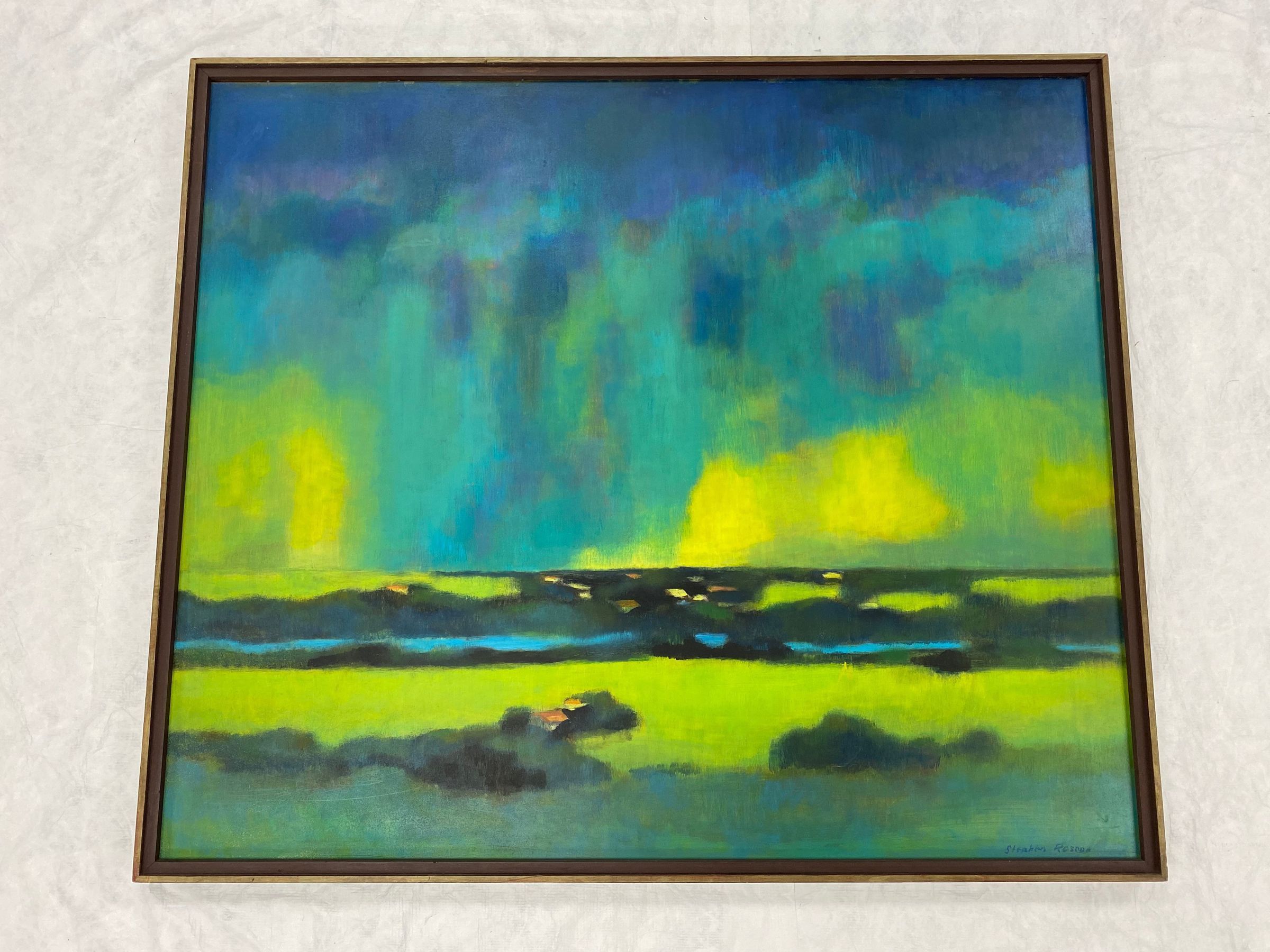 The Storm: Large square painting on Masonite mounted into original frame. The piece is a landscape with storm clouds. The bottom third of the piece features a yellow green field with darker greens in the foreground. The dark green also has small rectangles of orange and yellow to indicate rooftops. Behind the yellow green field are more dark greens and a river. Beyond the river more dark greens with yellow, orange and white rectangles for buildings. The top two thirds of the piece feature the stormy sky. The sky starts as a dark blue at the top blending into a turquoise and then finally yellow greens as it meets the ground.