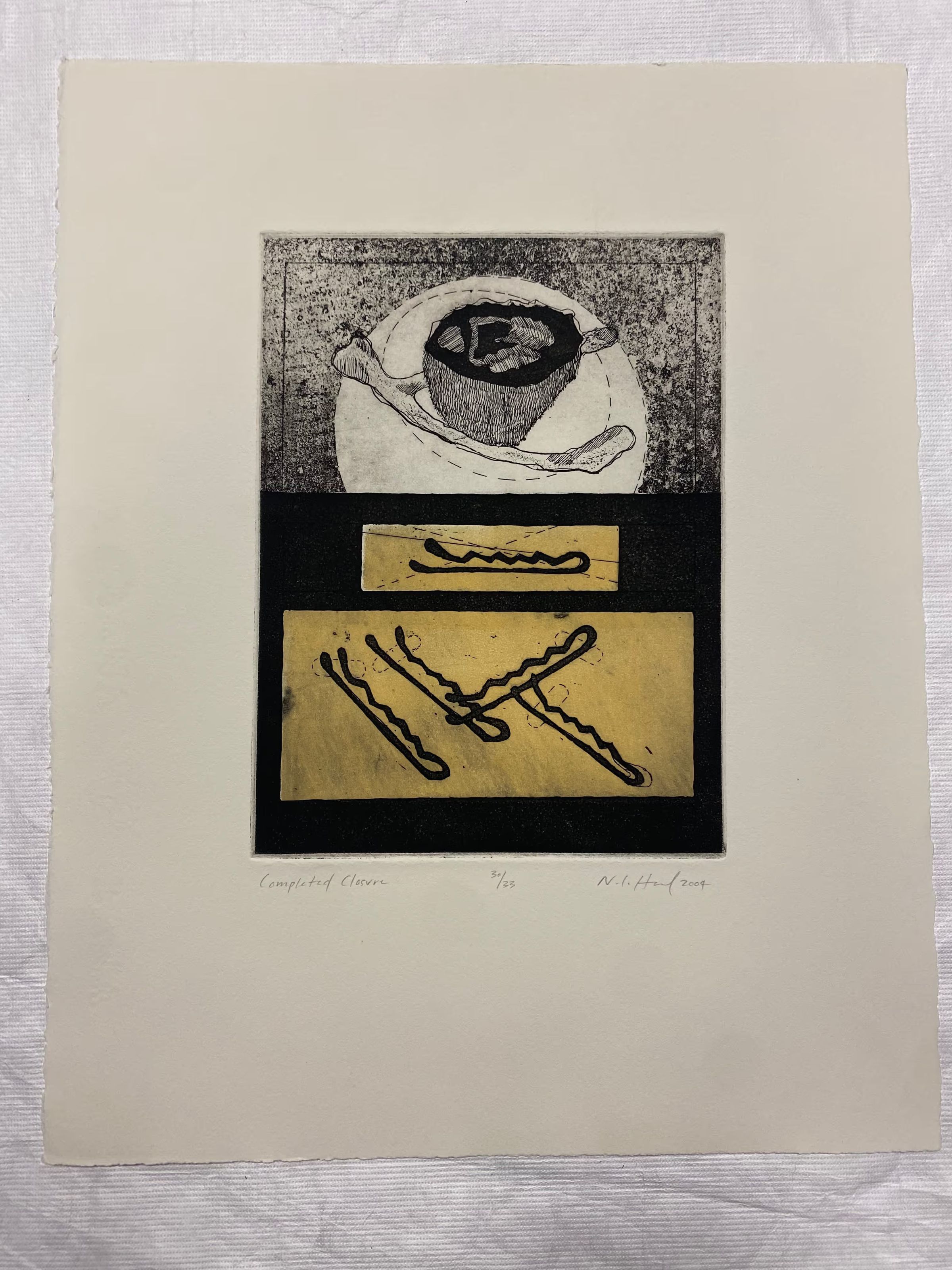 Completed Closure: Medium-sized multi-plate etching with three centralized motifs stacked vertically. The top image is of a circular shape with a wishbone and round of meat in the center of it in black, white, and gray tones. In the middle is a small yellow rectangle with a black bobby pin. At the bottom is a larger yellow rectangle with four black bobby pins in various directions.