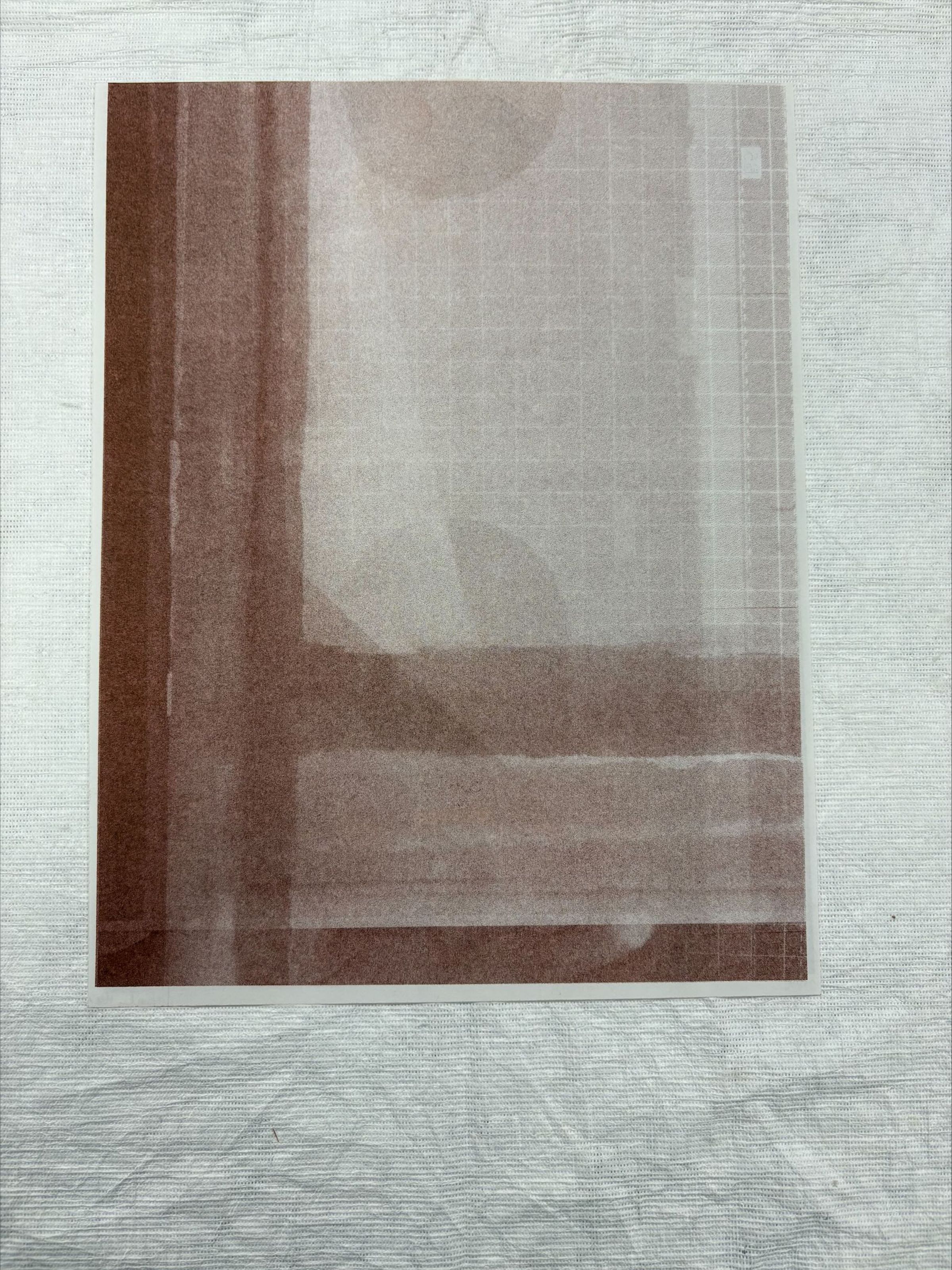 Front: A vertically oriented, medium sized risograph that uses a variety of brown color tones and white. The print depicts various geometric shapes overlapped one another on a grid like paper.