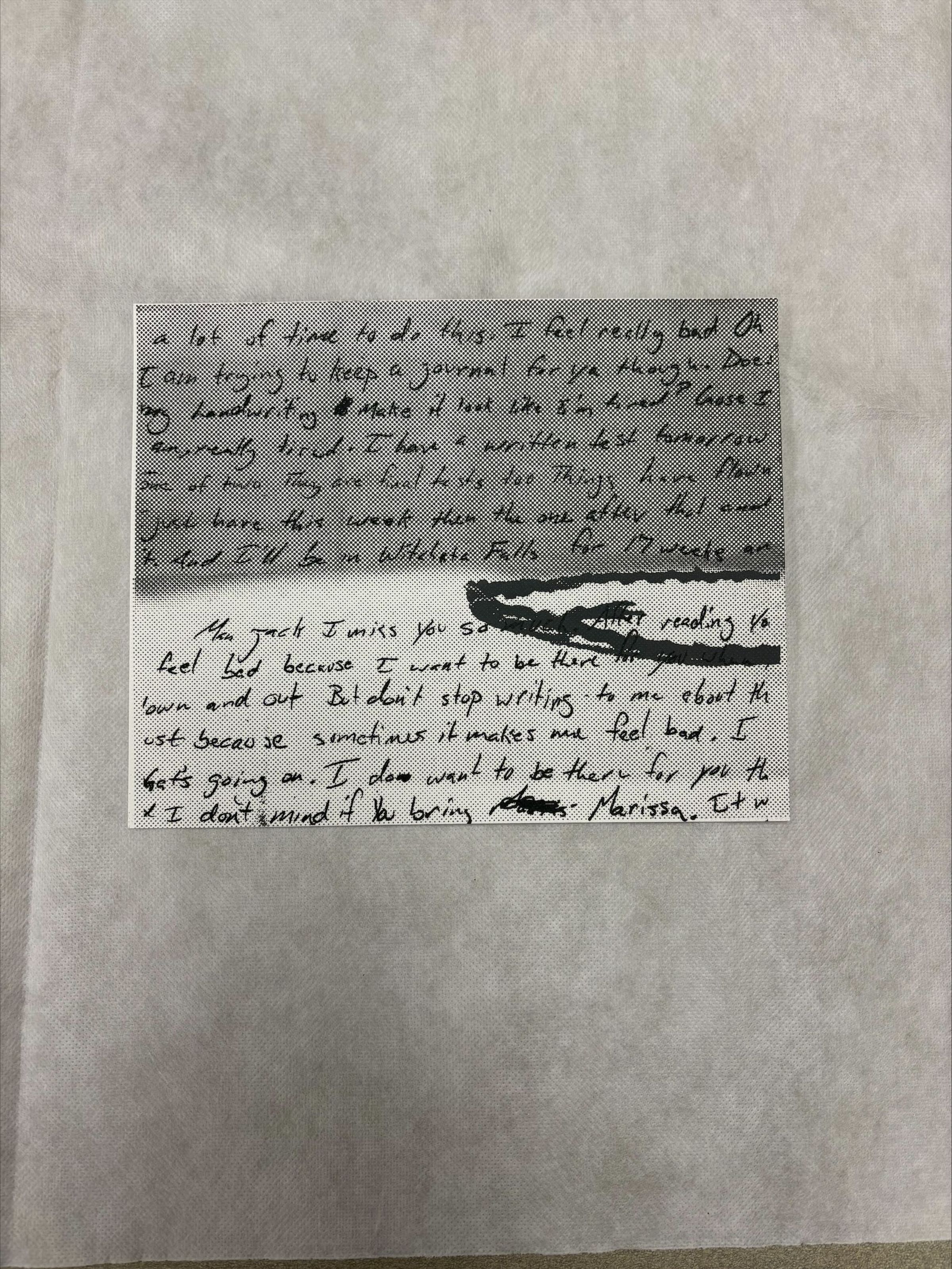 Front: A horizontally oriented, medium sized print that uses tones of black, grey and white. This print consists primarily of text that cover almost the entirety of the page with and artistic stroke distrubting the flow of text in the center proper left hand side.