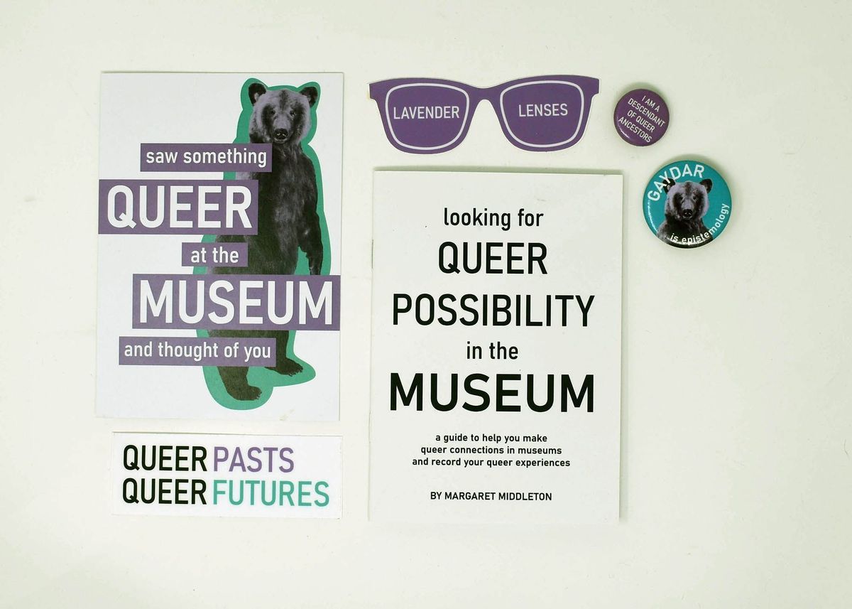 Postcard (with the image of a bear), stickers and a booklet.