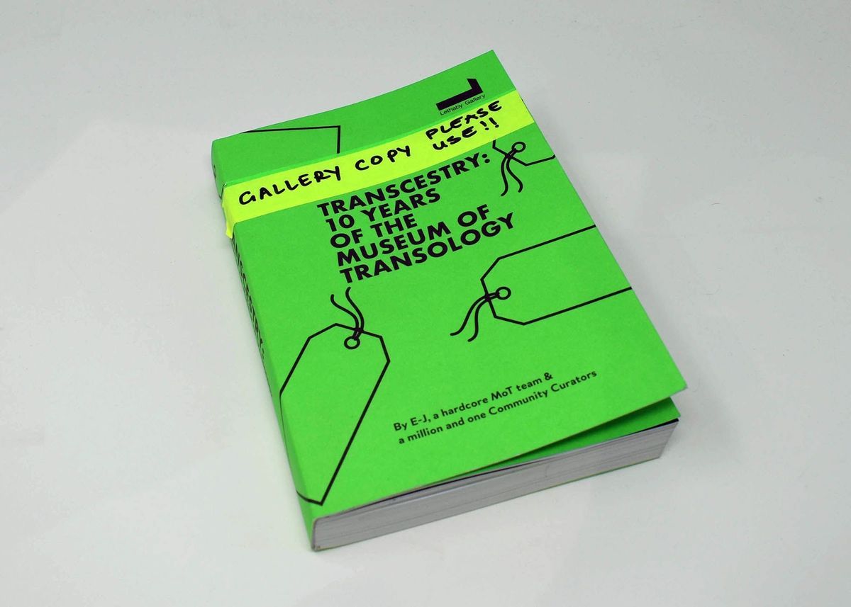 The image shows a green book titled "Transcestry: 10 Years of the Museum of Transology".