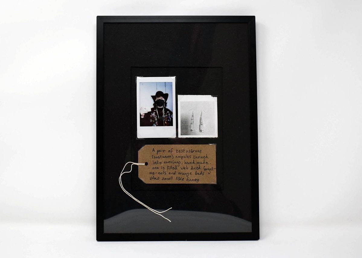 A black-framed collage showcases two Polaroids and a brown luggage tag.