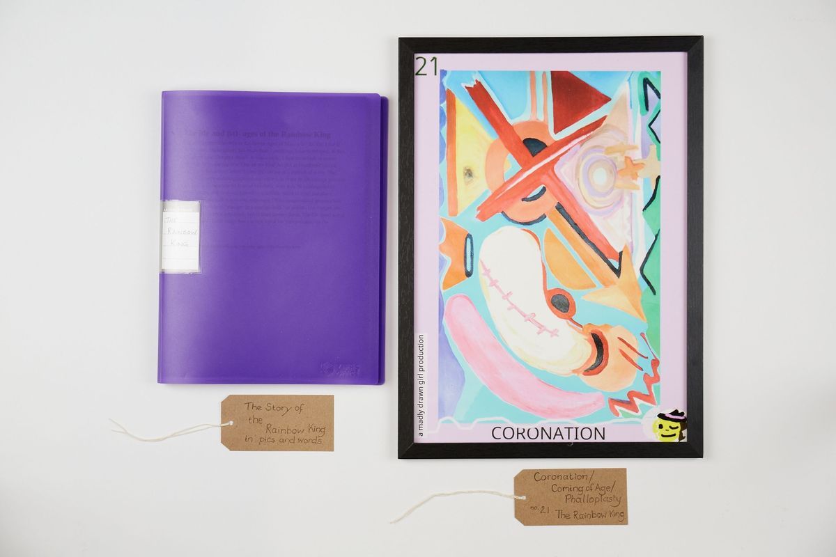 The image shows a vibrant abstract painting labeled "Coronation" beside a purple book.