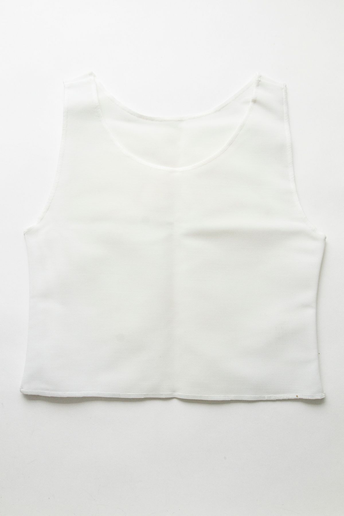 A white binder lay on a white background.