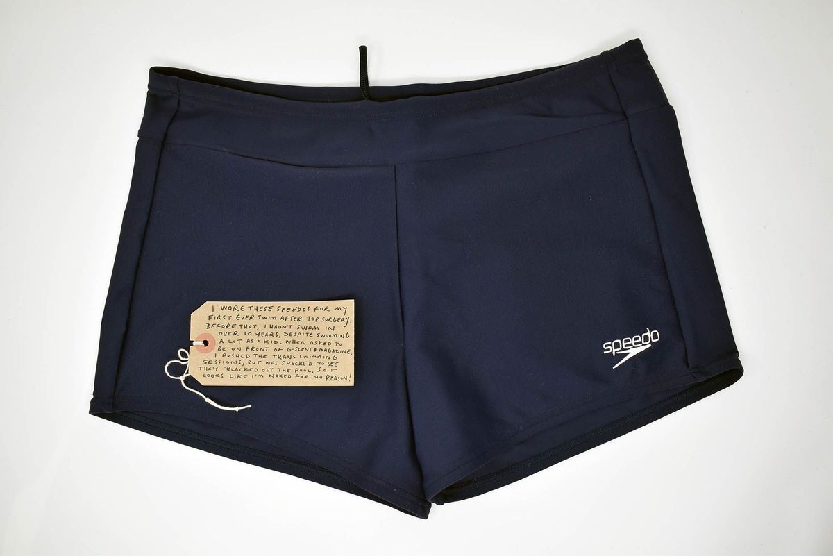 Navy blue "Speedo" swimming trunks with Speedo logo on bottom left leg.