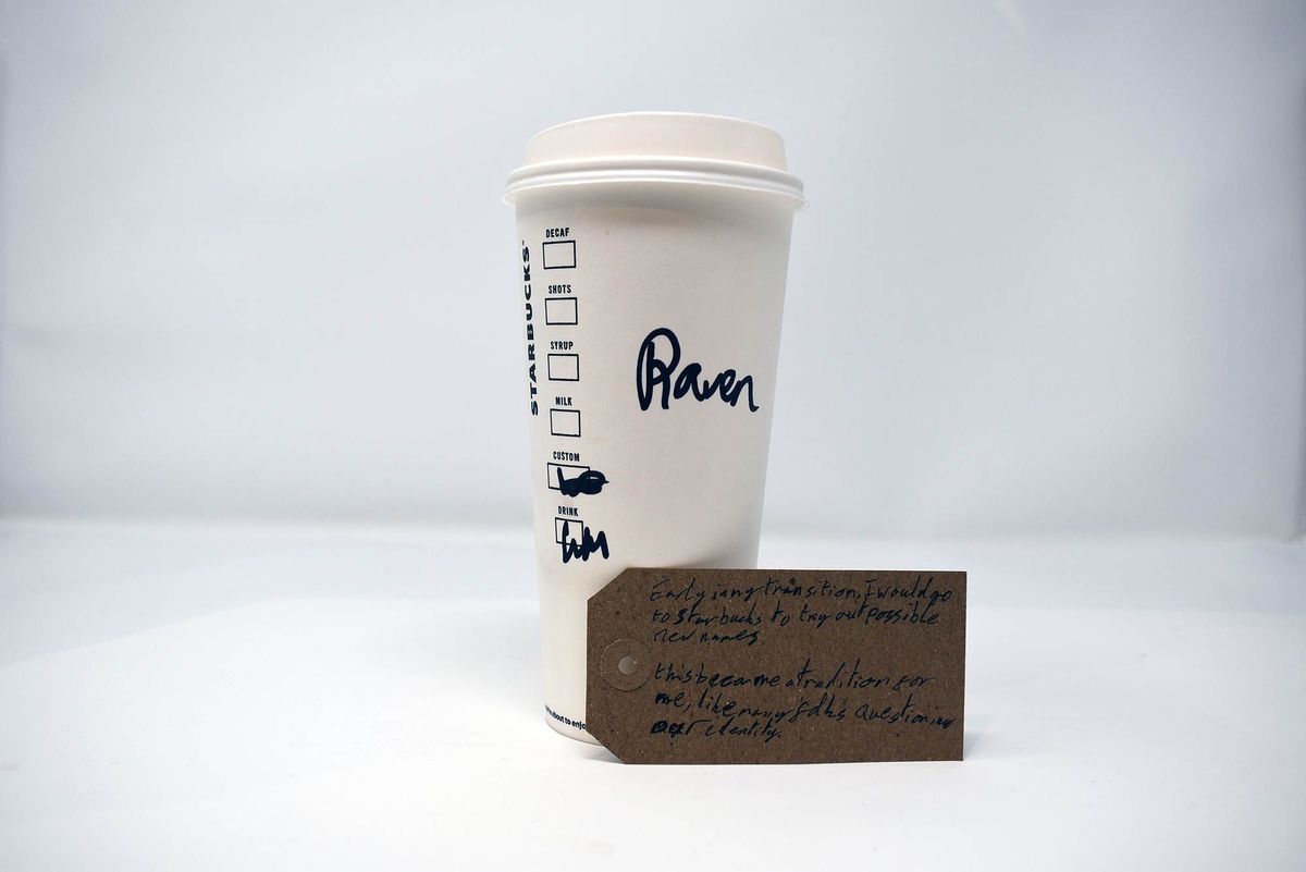 A Starbucks cup labeled "Raven" stands near a handwritten note about identity exploration.