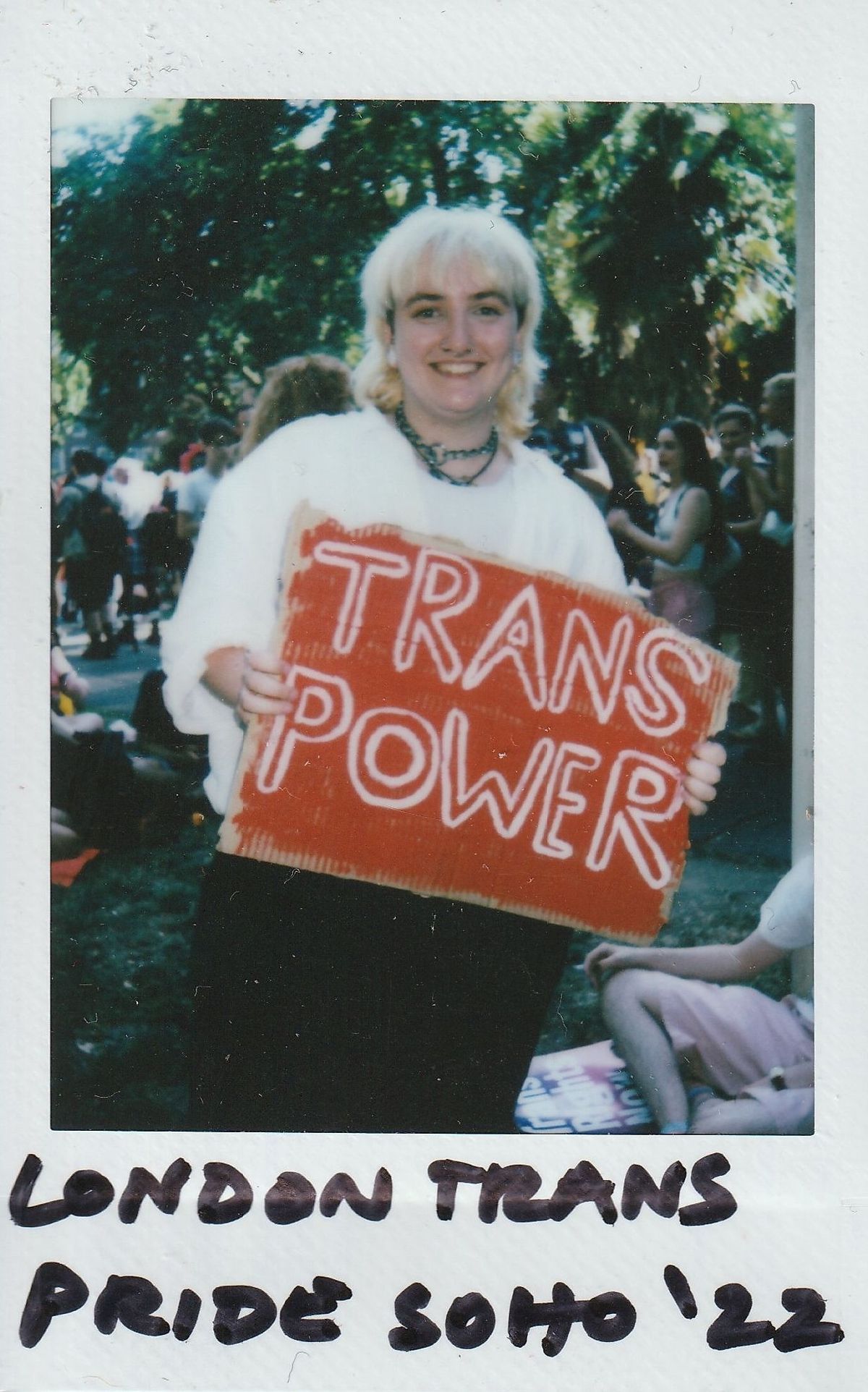 A person at London Trans Pride 2022 holds a sign reading "Trans Power".