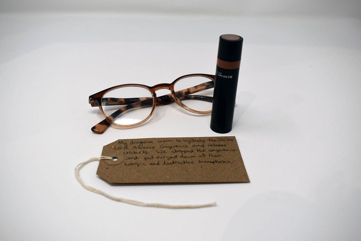 A pair of tortoiseshell glasses, a Rimmel lipstick and a brown, handwritten luggage tag.