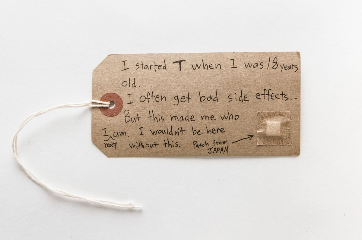 The tag shares a personal story about starting T at 18 and has a testosterone patch stuck onto it.
