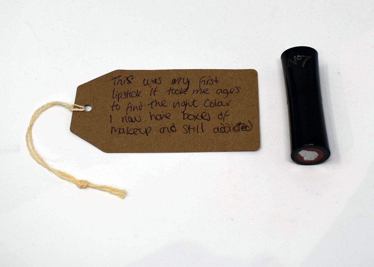 Black lipstick tube with "No 7" engraved on the top at the front of the tube.