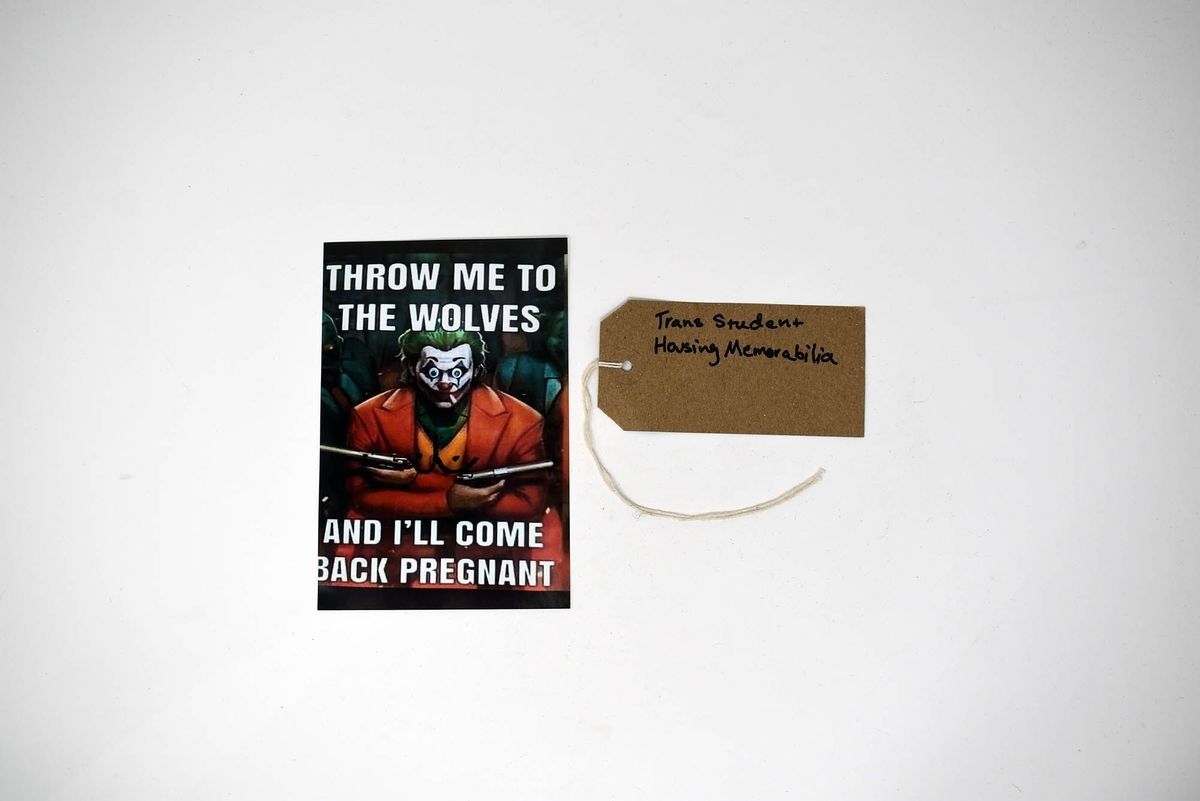 A photograph which has a person it and the words"Throw Me To The Wolves And I'll Come Back Pregnant" and a label sit against a white background.