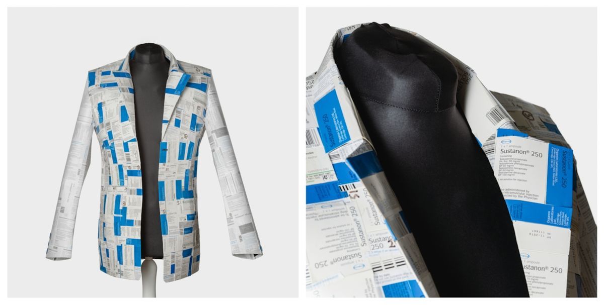 The image shows a mannequin wearing a unique jacket made from variously printed pharmaceutical packaging materials.