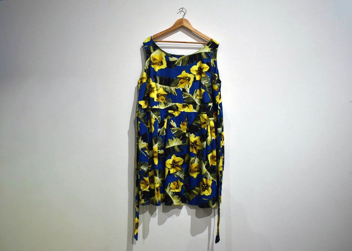 A dress which has blue, yellow and black floral print.