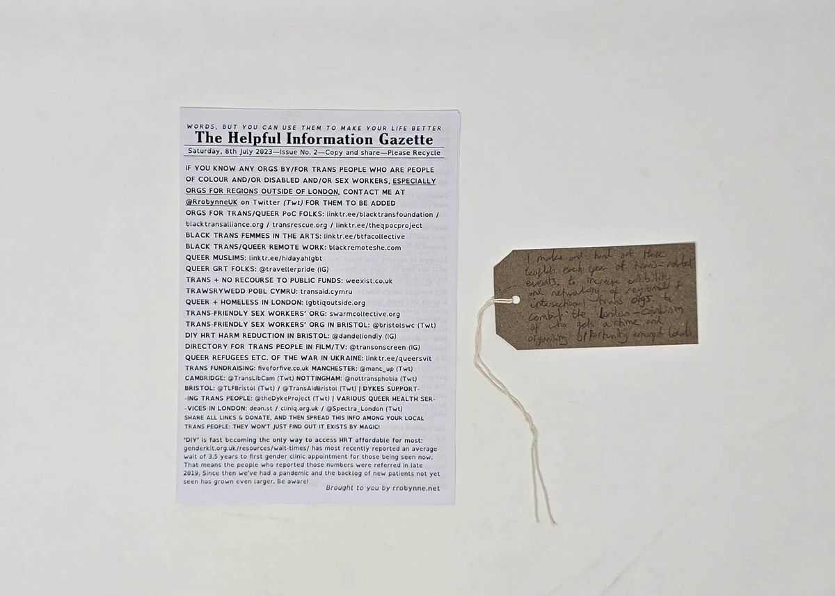 A leaflet and tag discussing trans support organisations.