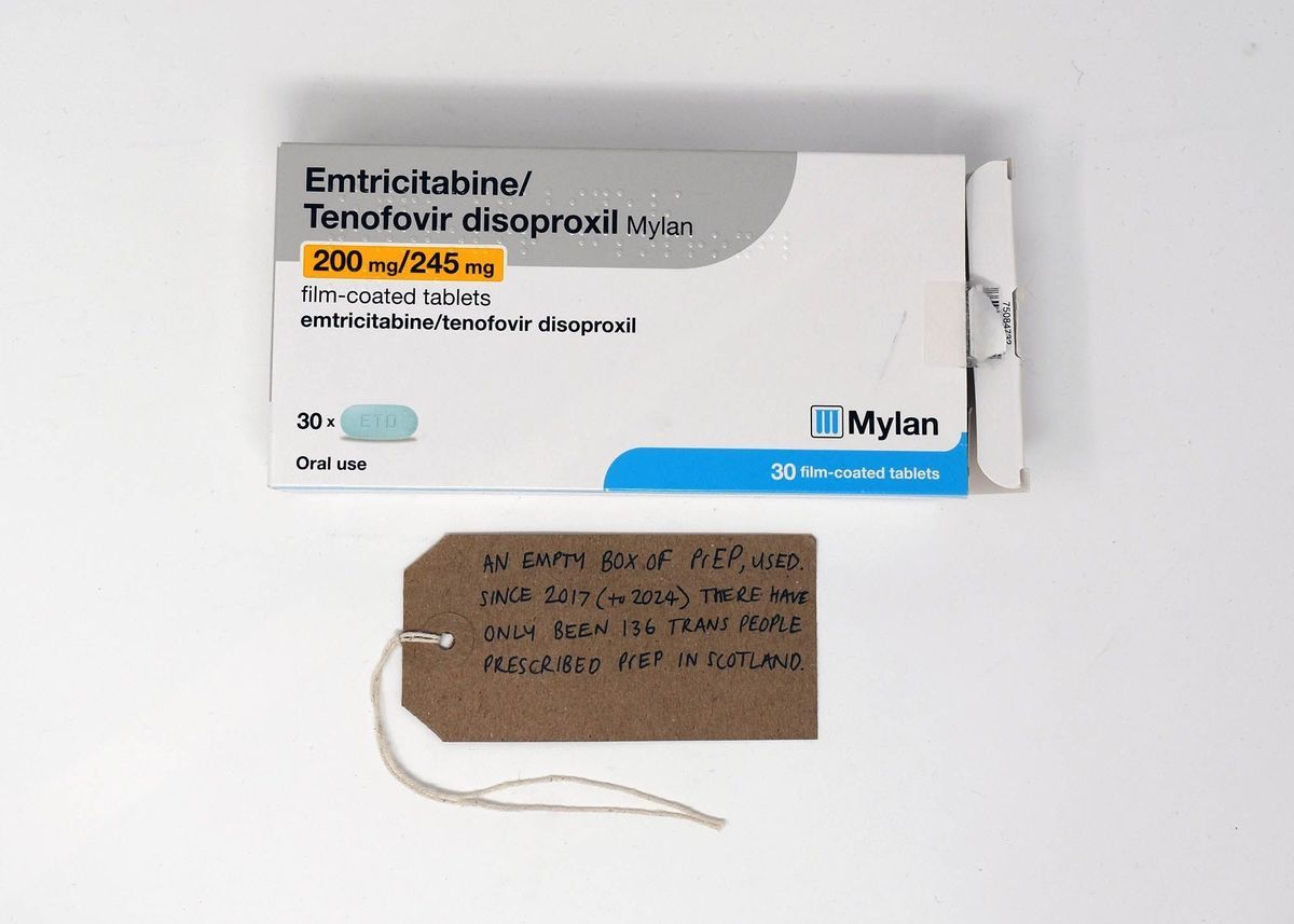 An empty box of PrEP (Emtricitabine/ Tenofovir disoproxil). With a brown handwritten luggage tag.