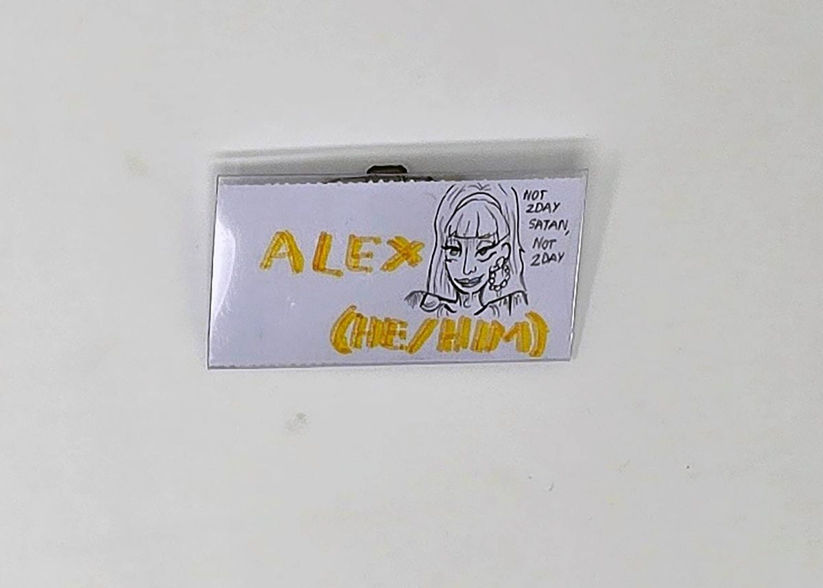 Name badge reads "Alex" with an illustration.