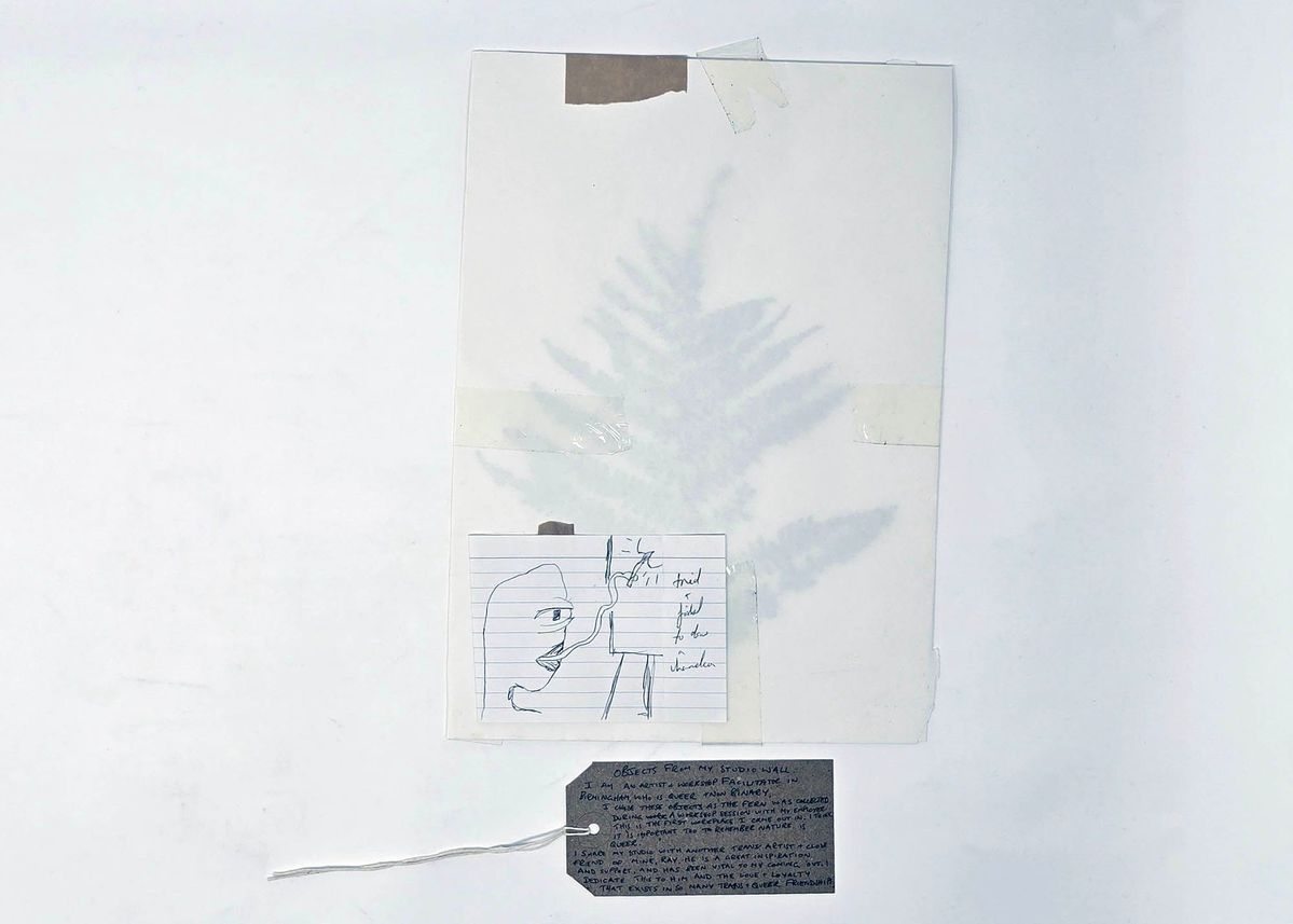 A collage which includes a fern leaf and an illustration on lined paper.