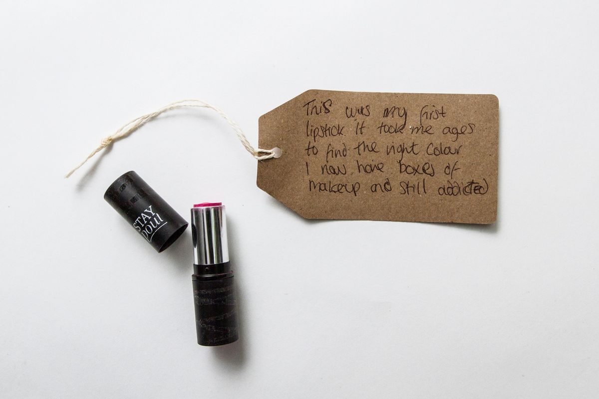 Black lipstick tube reading "Stay Pout"