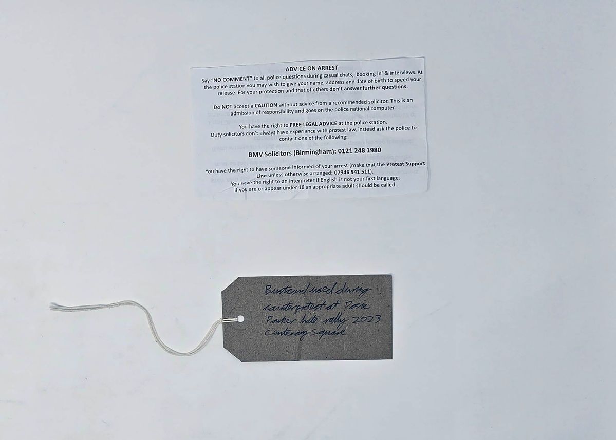 Bust card, along with tag.