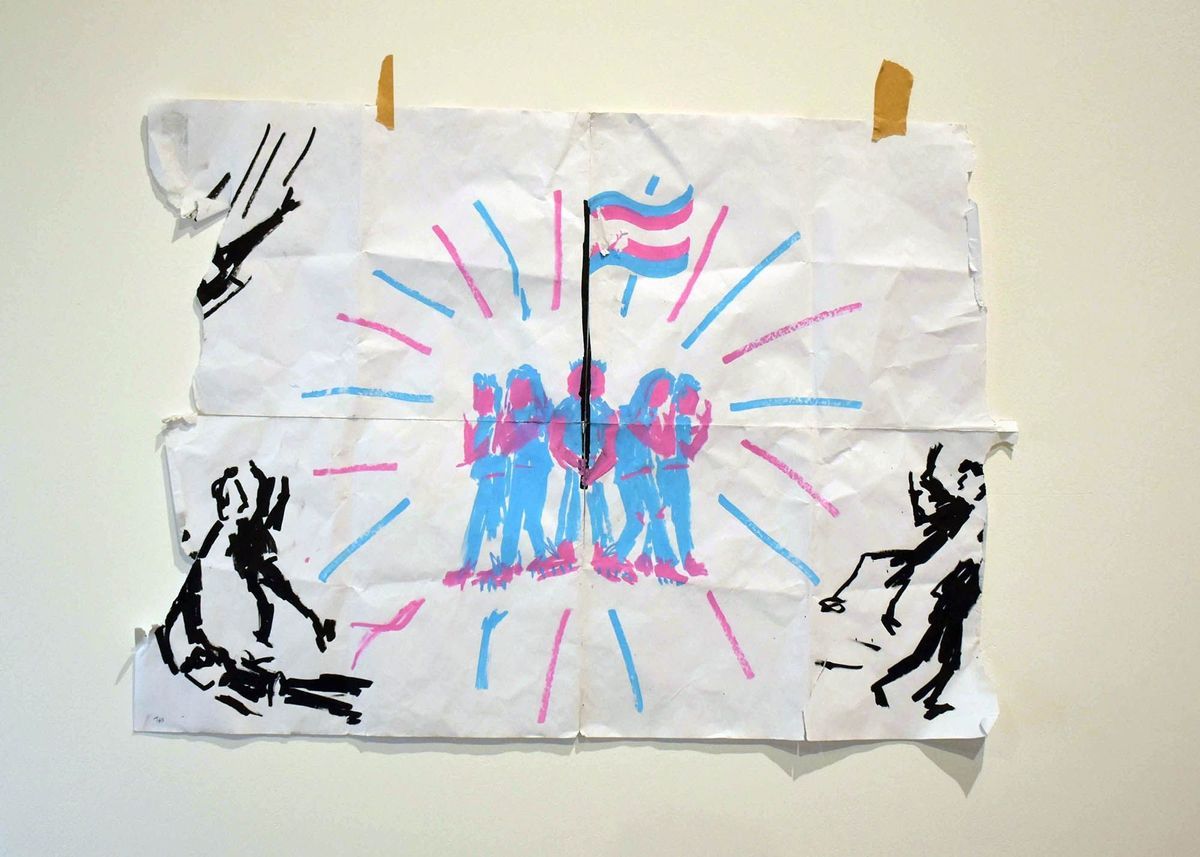 The image shows a ripped and folded piece of paper featuring five abstract figures in blue and pink around a trans pride flag, with blue and pink lines coming from them. There are figures in black around them and a helicopter to the top left..