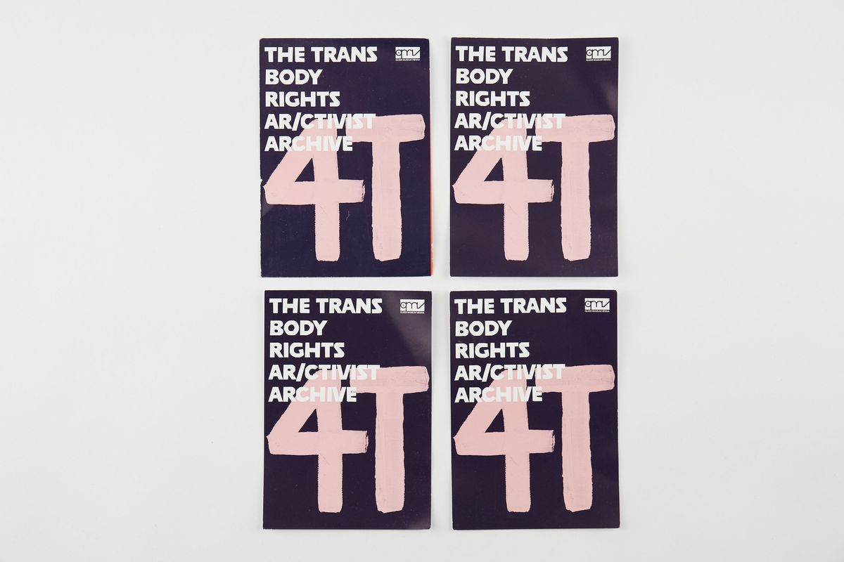 Four identical postcards. Their background is dark blue and has the letters "4T" in pink. Over the top is the text "THE TRANS BODY RIGHTS AR/CTIVIST ARCHIVE" in white with the Queer Museum Vienna logo on the top right corner.