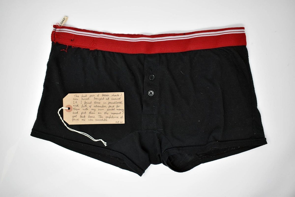 Black boxers with a red waistband with white stripe.