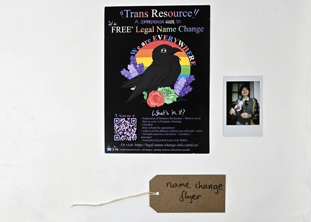 A "Trans Resource" flyer giving information and links about free legal name change. Also a polaroid and a brown, handwritten luggage tag.