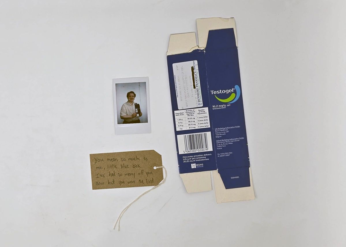 Testogel Box (from Dunmore pharmacy), a Polaroid and a brown luggage tag