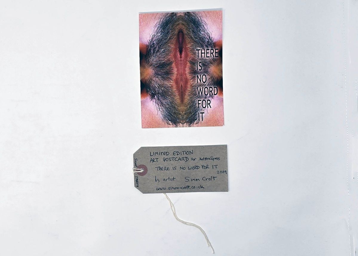 Postcard showing a photo of an upperlip reflected horizontally across the page.