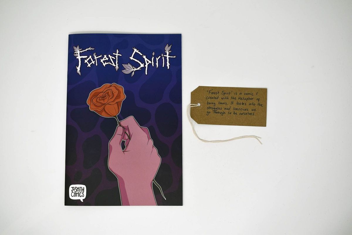 The image shows a comic book titled "Forest Spirit" with a brown tag with writing on it.