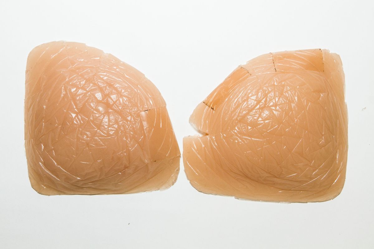 Pair of prosthetic silicone breasts.