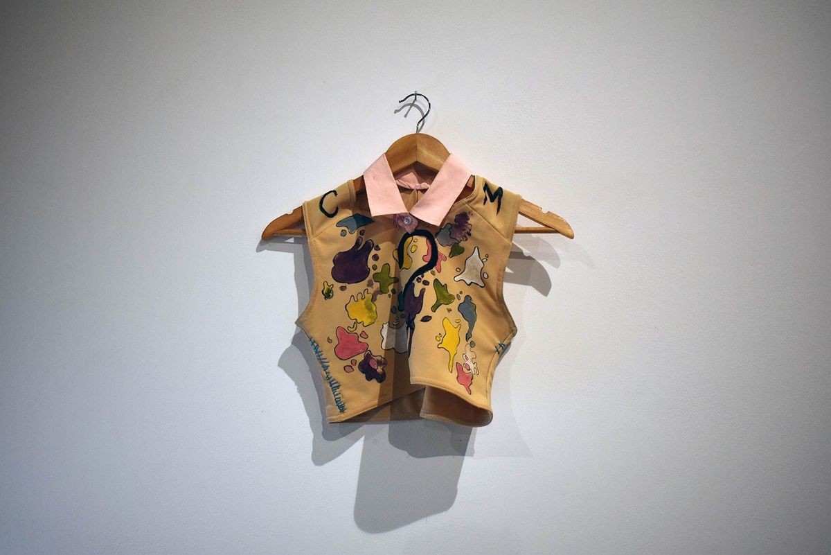 GC2B binder colourfully painted with sewn on pink collar