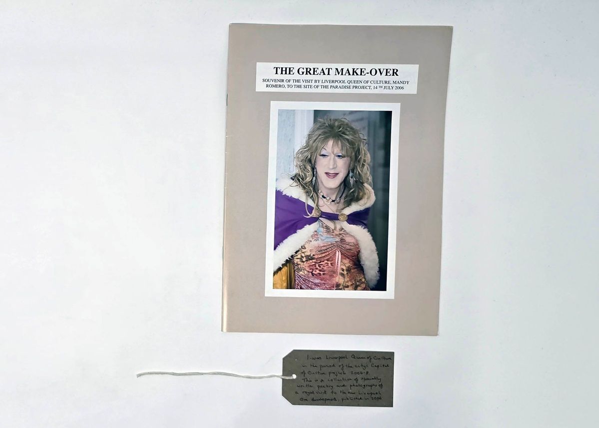 A booklet titled "The Great Make-over" features a person in colorful, elegant attire. With a brown, handwritten luggage tag.