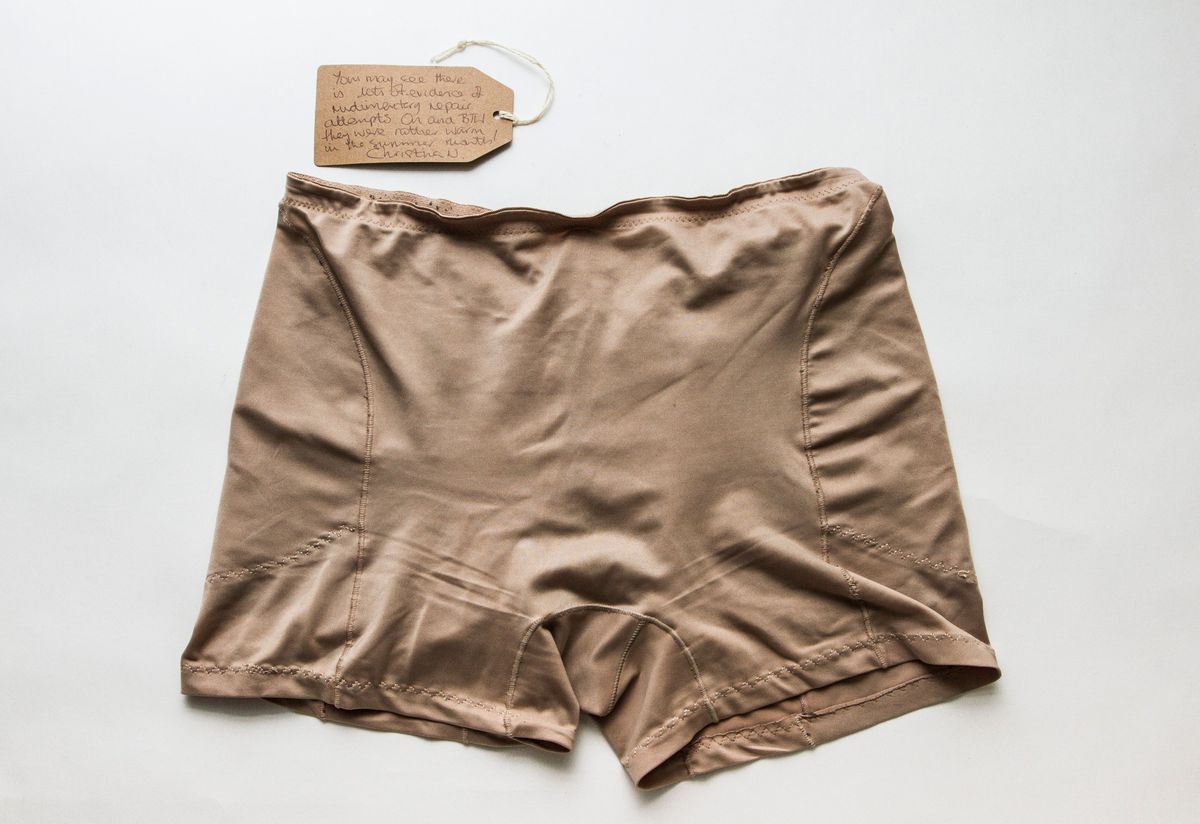 A pair of beige control pants with evidence of hand stitching in places.