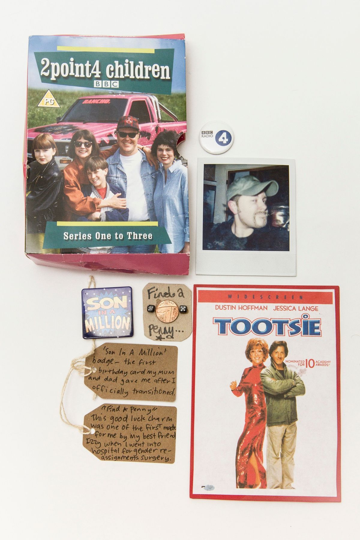 The image includes a DVD cover, a badge, a photo, movie artwork, and labeled personal items.
