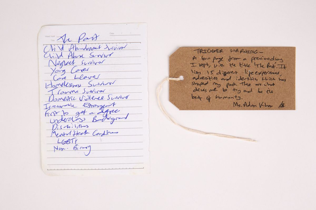 The image shows a sheet of lined paper with a list of writing . Next to it is a brown tag with handwritten text.