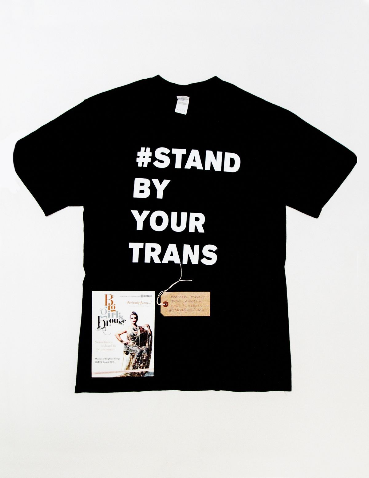 Black T-shirt with white block letters reading "# STAND BY YOUR TRANS"
