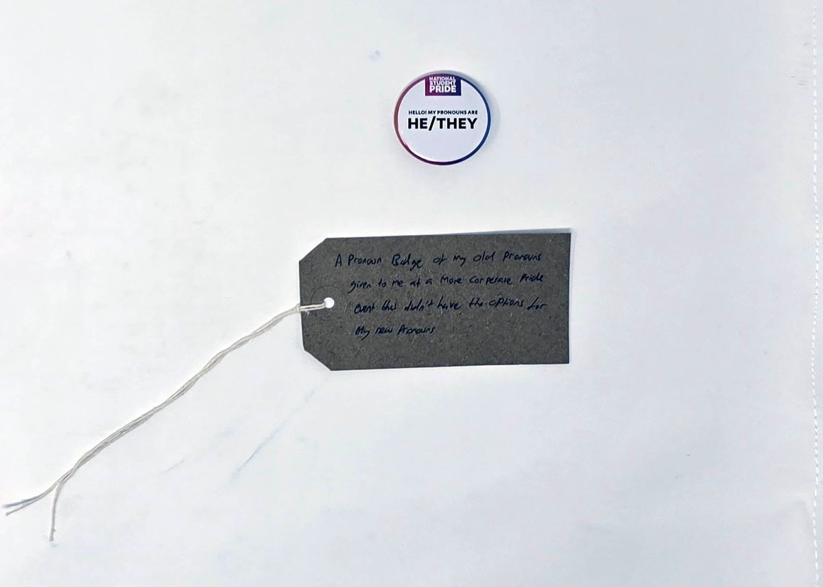 The image shows a badge with "He/They" pronouns and a tag explaining its relevance.