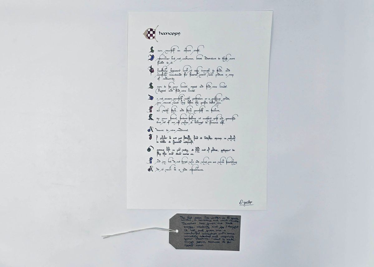 Poem written in Court Hand and Secretary Hand calligraphy. The first letter of each line is colorfully illuminated. With a brown, handwritten luggage tag.