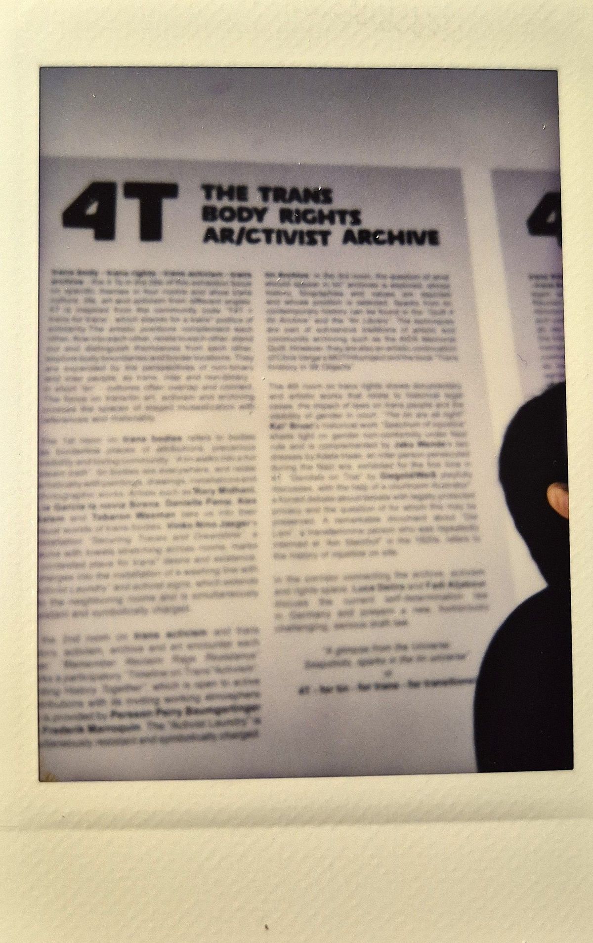 The image shows a blurred text about "The Trans Body Rights Ar/ctivist Archive".