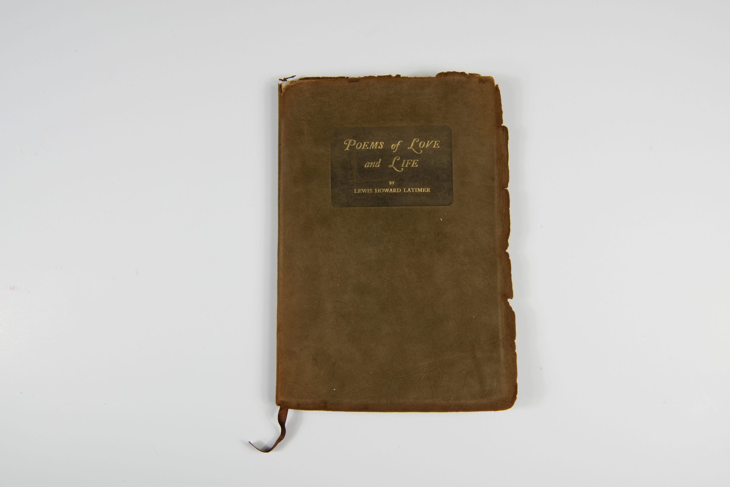 Poems of Love and Life Cover; The image showcases an old, worn book titled